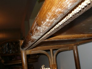 Penicillium crysogenum mold under table in humid home. Closer view of moldy furniture. Humidity mold problems are only visible if one looks very closely, and looks on the bottom side of the furniture in the correct lighting.