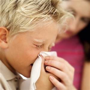 Kid with mold allergies sneezing hard.