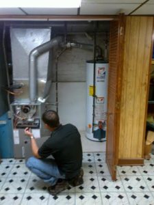 Inspector or other service person conducting an AC inspection. In humid Broward county AC humidity control is very important. 