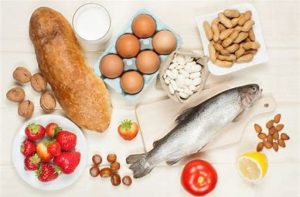 Food allergies image showing fish, nuts, eggs, mild, and even fruit.