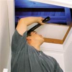 A mold inspector looking into an attic. Air sampling problems can be avoided if your mold inspector does not just rely on mold sampling alone. 
